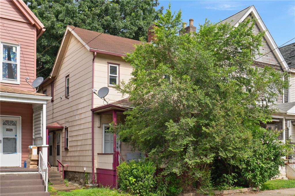 525 Larimer Avenue Turtle Creek, PA 15145 - Photo 2 of 28 a view of a house with a tree