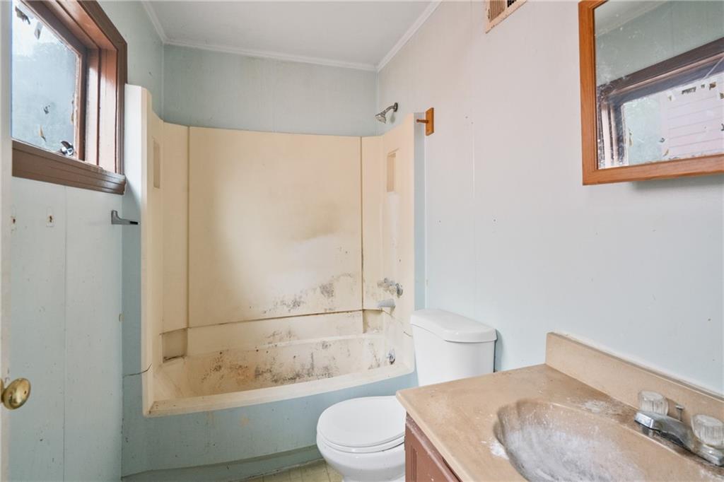 525 Larimer Avenue Turtle Creek, PA 15145 - Photo 24 of 28 a bathroom with a sink a toilet and shower