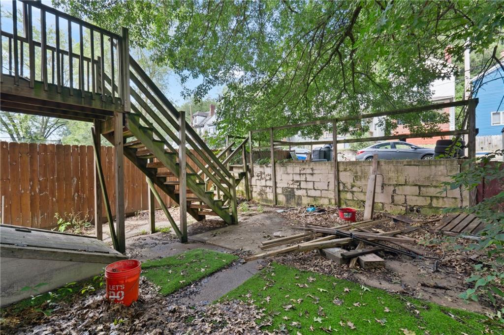 525 Larimer Avenue Turtle Creek, PA 15145 - Photo 27 of 28 a view of a backyard with a bench