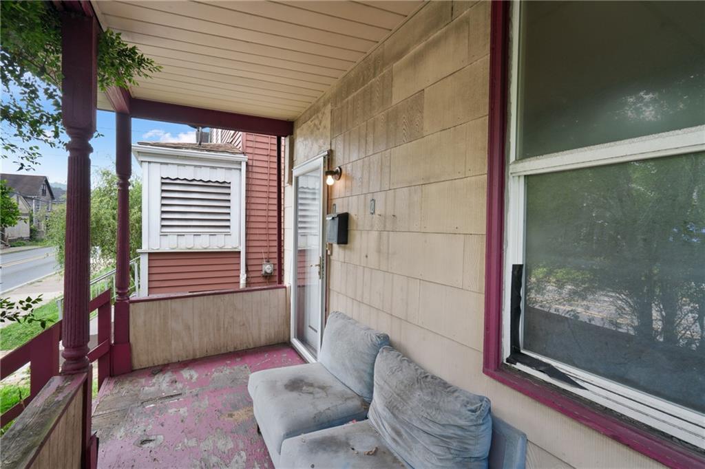 525 Larimer Avenue Turtle Creek, PA 15145 - Photo 4 of 28 a view of a door and chair in the balcony