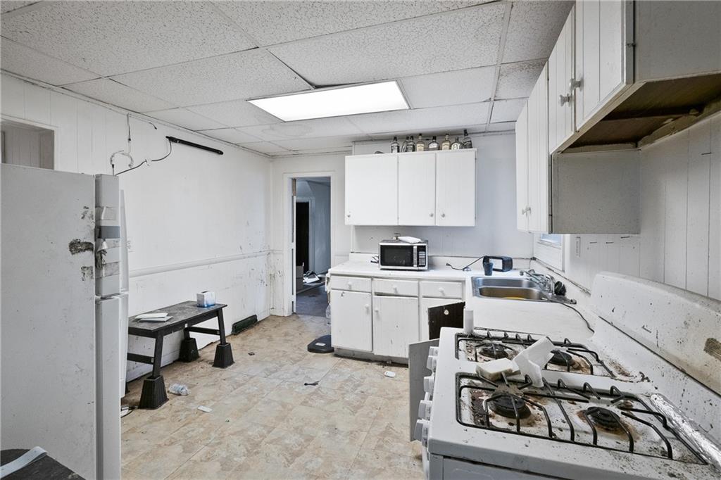 525 Larimer Avenue Turtle Creek, PA 15145 - Photo 7 of 28 a kitchen with sink cabinets and appliances
