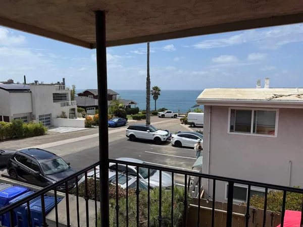 a view of a balcony dining table and chairs