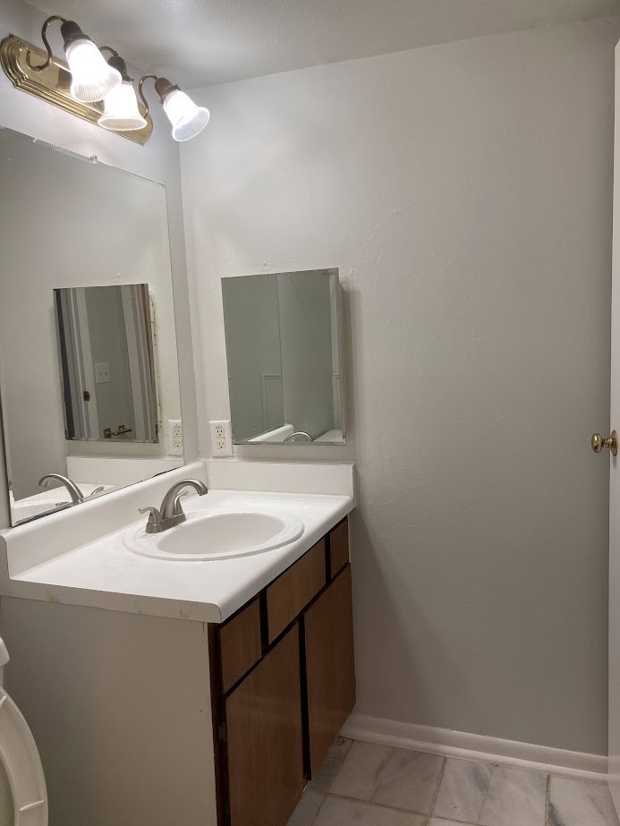 3075 Walnut Bend Lane, Unit 33 Houston, TX 77042 - Photo 20 of 25 a bathroom with a sink and a mirror
