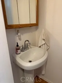 a bathroom with a sink and a window