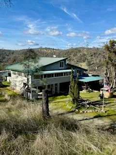 a view of a lake with a table and chairs