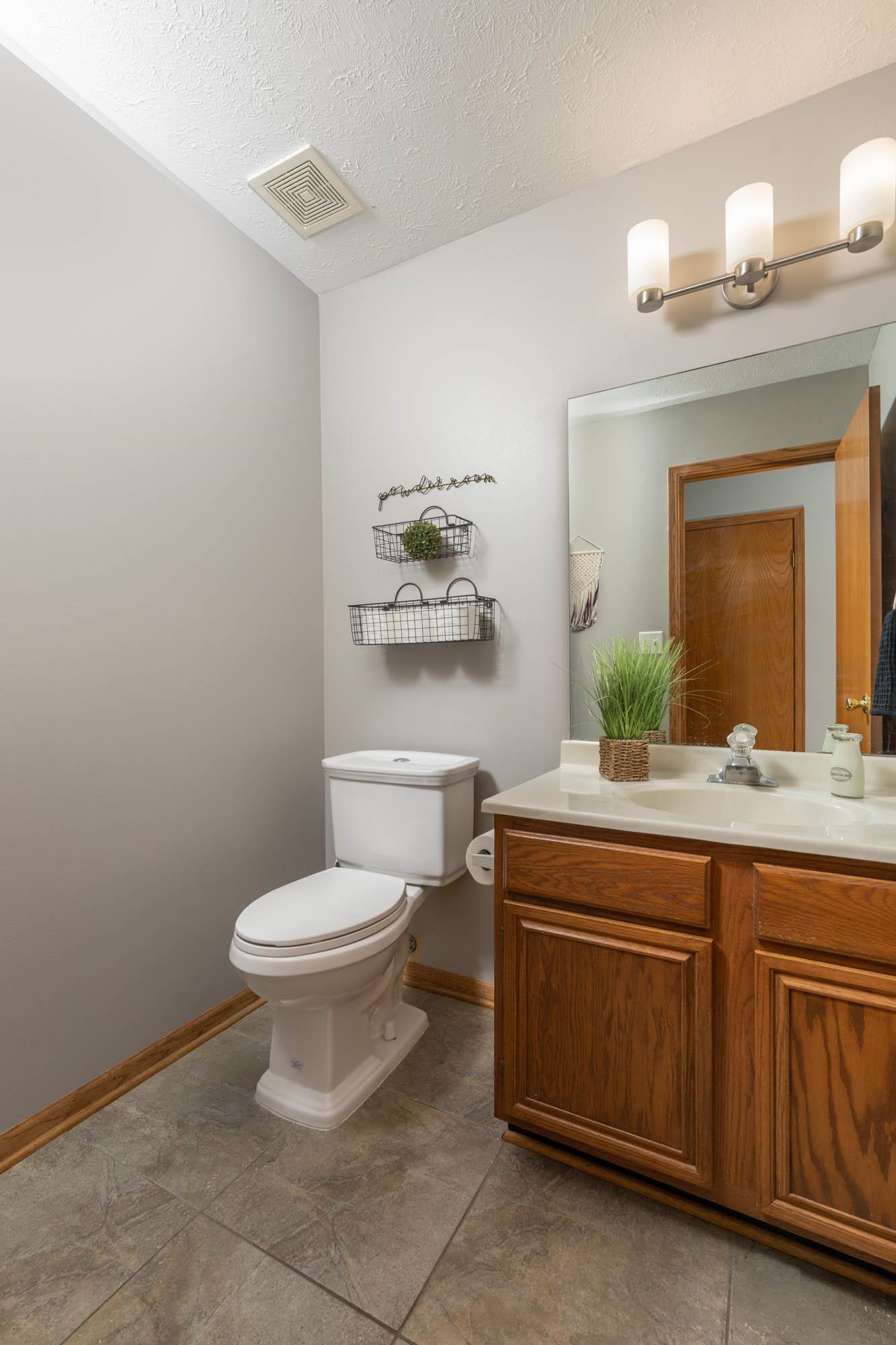 530 Pin Oak Road Rockton, IL 61072 - Photo 16 of 33 a bathroom with a toilet a sink and mirror