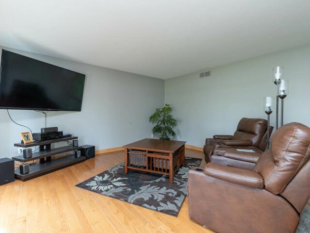 530 Pin Oak Road Rockton, IL 61072 - Photo 6 of 33 a living room with furniture and a flat screen tv