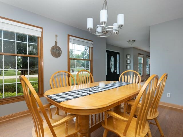 530 Pin Oak Road Rockton, IL 61072 - Photo 8 of 33 a view of a dining room with furniture wooden floor and chandelier