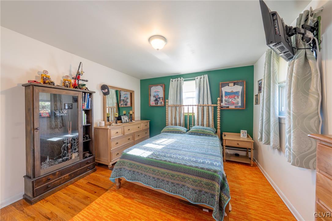 70 Colonial Road Allentown, PA 18109 - Photo 15 of 32 a bedroom with furniture and a wooden floor