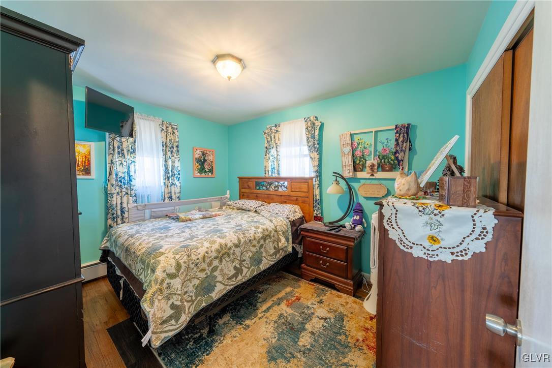 70 Colonial Road Allentown, PA 18109 - Photo 17 of 32 a bedroom with a bed and a mirror