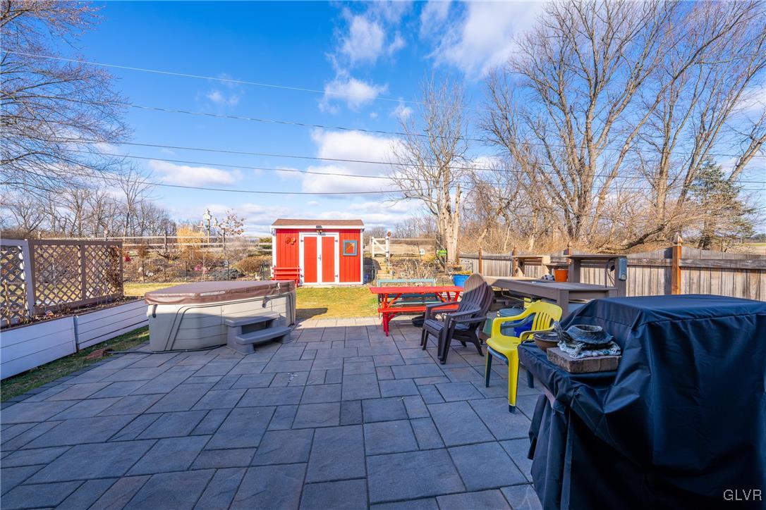 70 Colonial Road Allentown, PA 18109 - Photo 24 of 32 a view of a patio with dining table and chairs with wooden fence