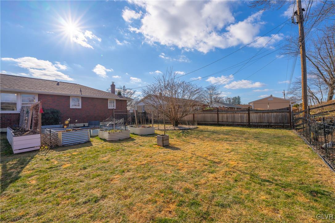 70 Colonial Road Allentown, PA 18109 - Photo 28 of 32 a view of a swimming pool with a table and chairs