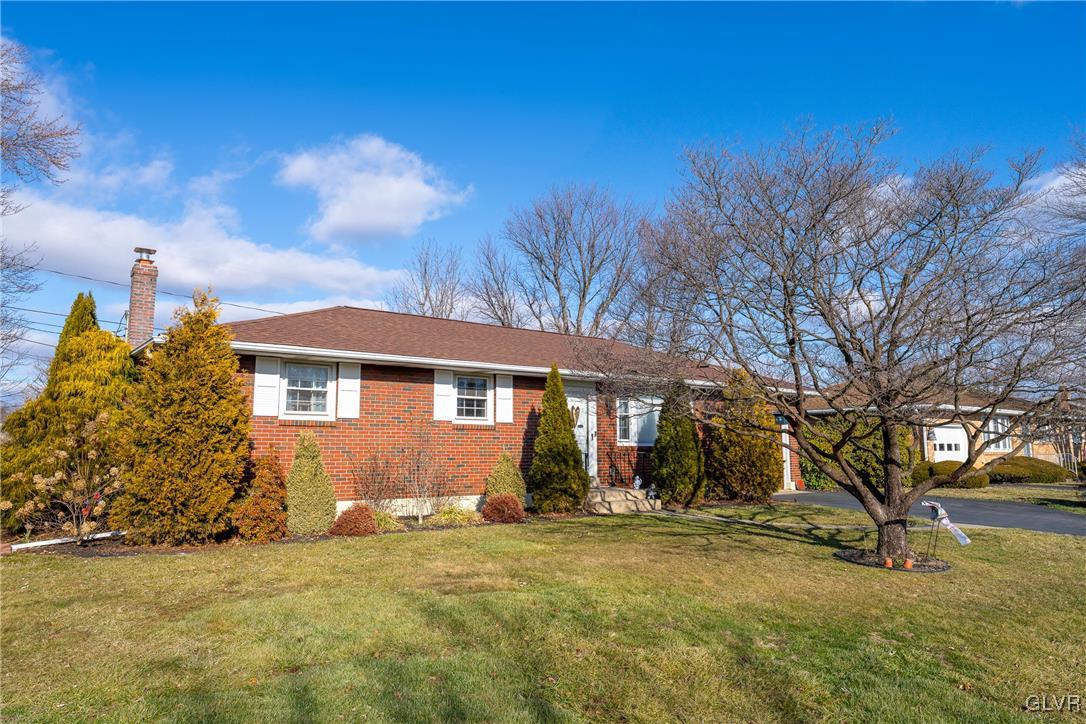 70 Colonial Road Allentown, PA 18109 - Photo 3 of 32 a front view of a house with a yard