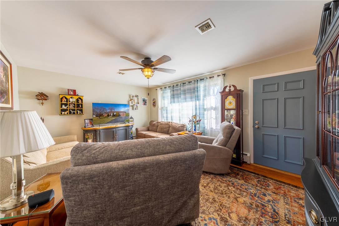 70 Colonial Road Allentown, PA 18109 - Photo 8 of 32 a living room with furniture and a rug