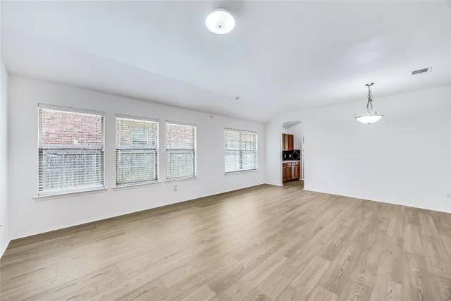 a living room with lots of furniture and a table