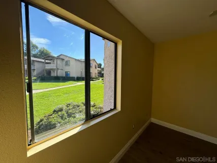 a view of a room with a large window and a floor to ceiling window