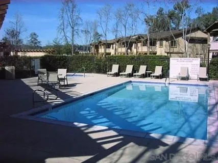 a view of a swimming pool with a patio
