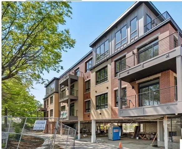 a front view of a building with street view
