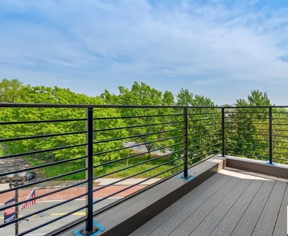 a view of a wooden deck with a bench