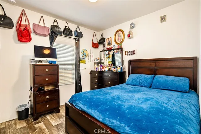 a bedroom with a bed and closet