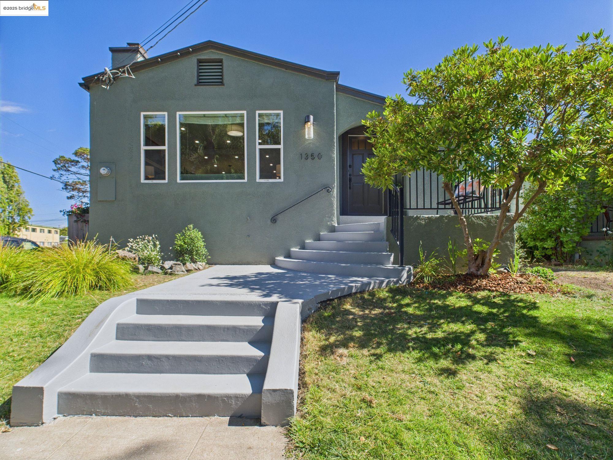 1350 Parker Street Berkeley, CA 94702 - Photo 1 of 1 a front view of a house with a yard