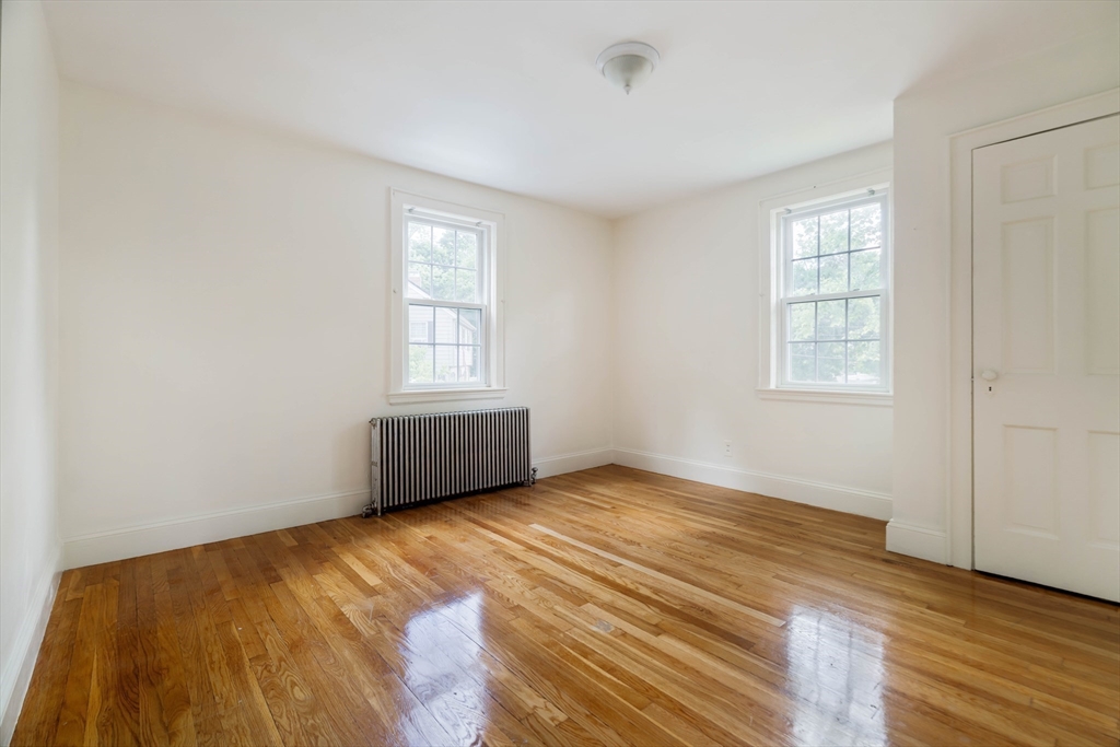 7 St Marys Road Milton, MA 02186 - Photo 19 of 31 an empty room with wooden floor and windows