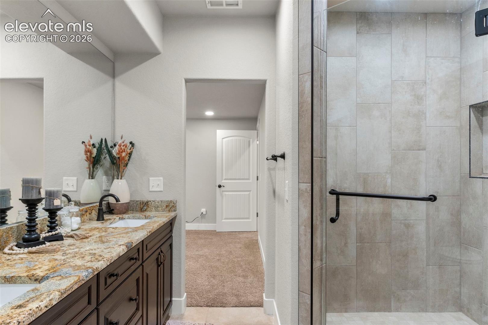 2480 North Log Road Calhan, CO 80808 - Photo 32 of 50 Tile shower with bench and glass door