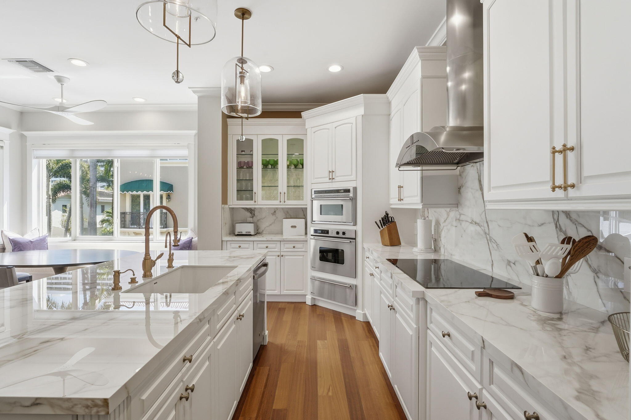 921 Osceola Drive, Unit 2 Boca Raton, FL 33432 - Photo 14 of 69 a large kitchen with stainless steel appliances kitchen island granite countertop a sink and cabinets
