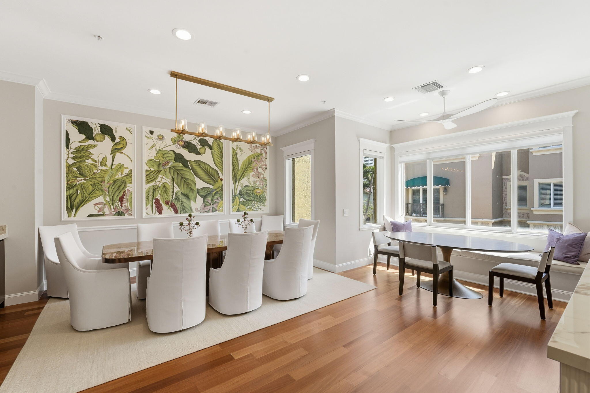 921 Osceola Drive, Unit 2 Boca Raton, FL 33432 - Photo 16 of 69 a dining room with wooden floor a chandelier a glass table and chairs