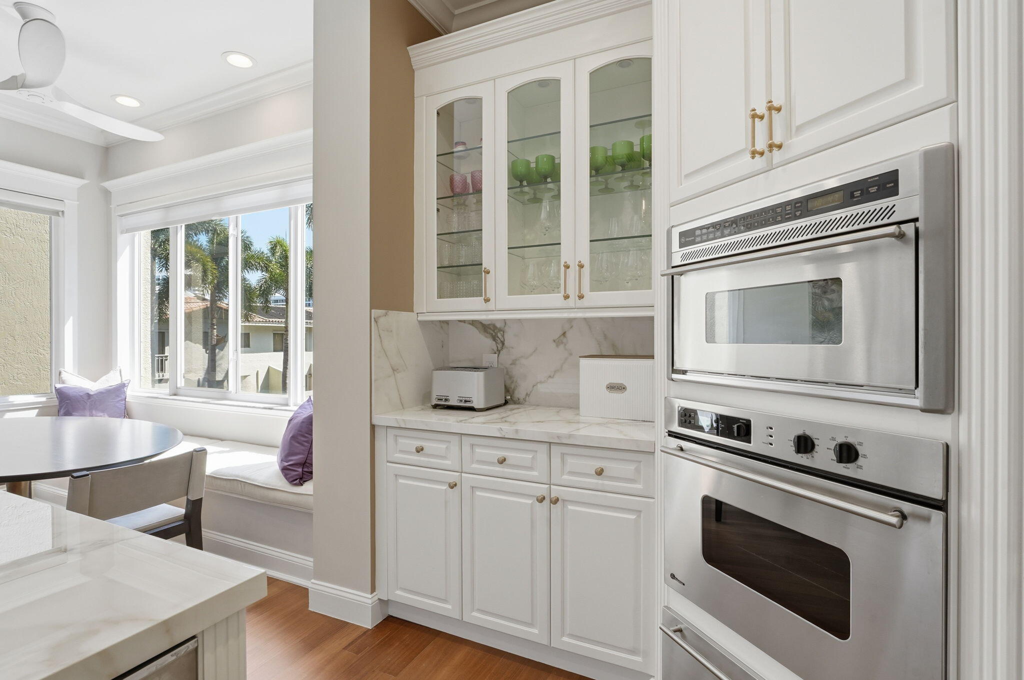 921 Osceola Drive, Unit 2 Boca Raton, FL 33432 - Photo 20 of 69 a kitchen with white cabinets and appliances