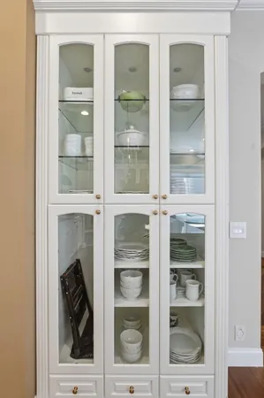 a view of a livingroom with wooden floor and furniture