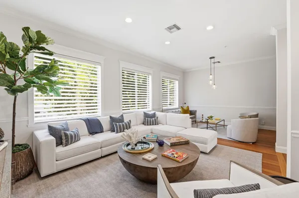 a bedroom with a bed and glass door