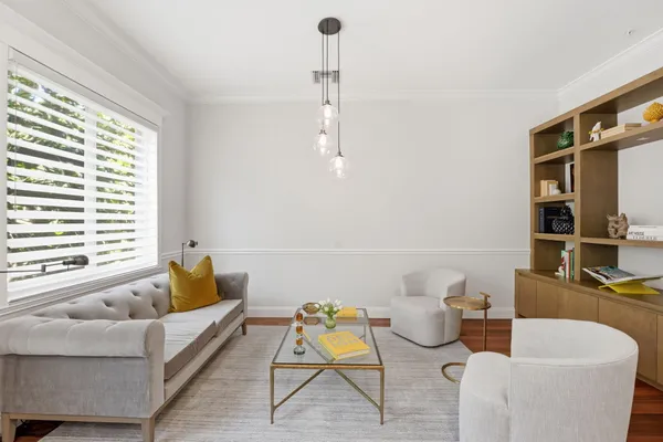 an empty room with wooden floor