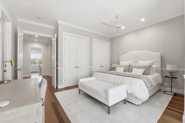 a bedroom with two beds and a couch