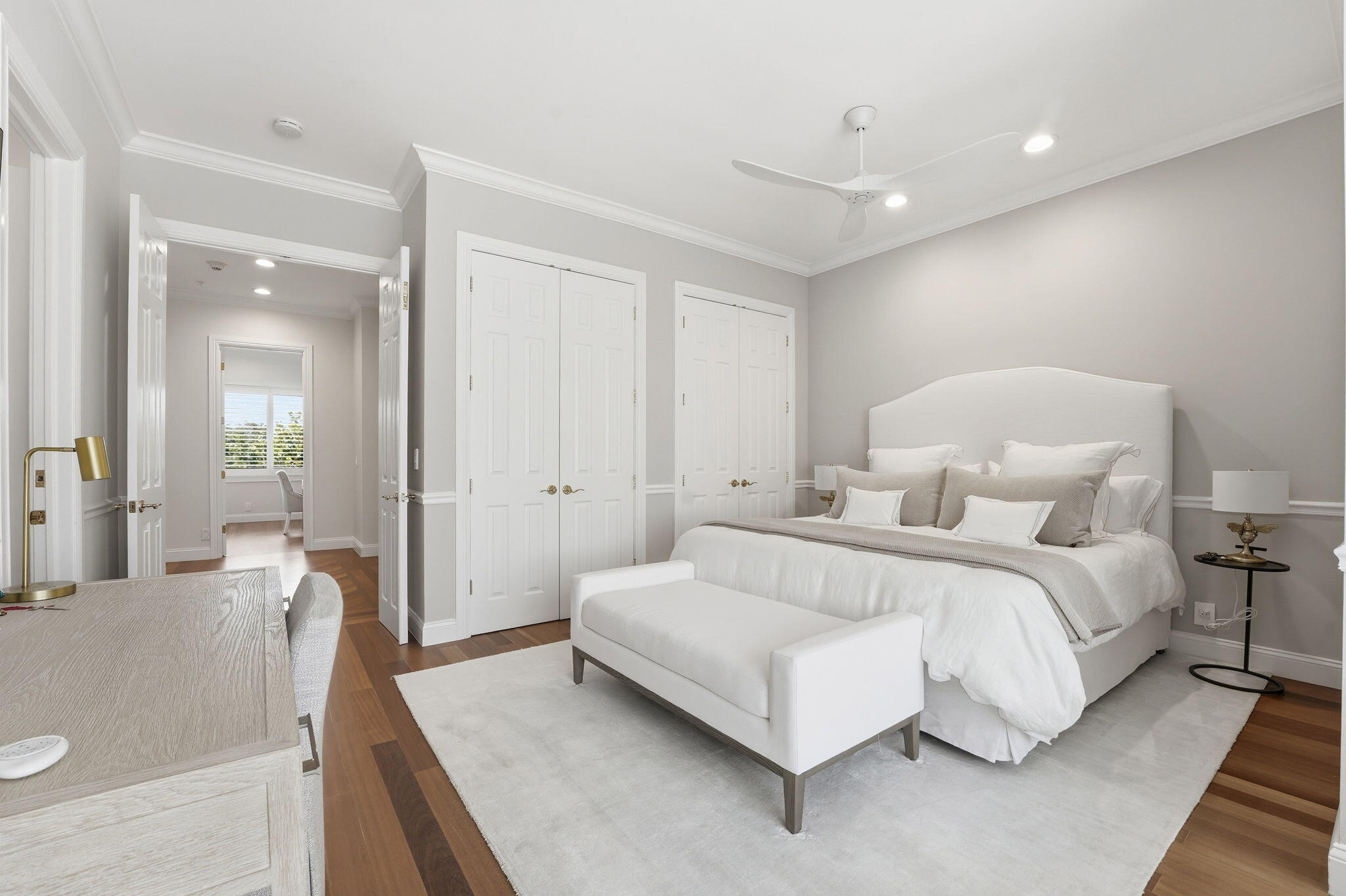 921 Osceola Drive, Unit 2 Boca Raton, FL 33432 - Photo 36 of 69 a spacious bedroom with a bed and a couch