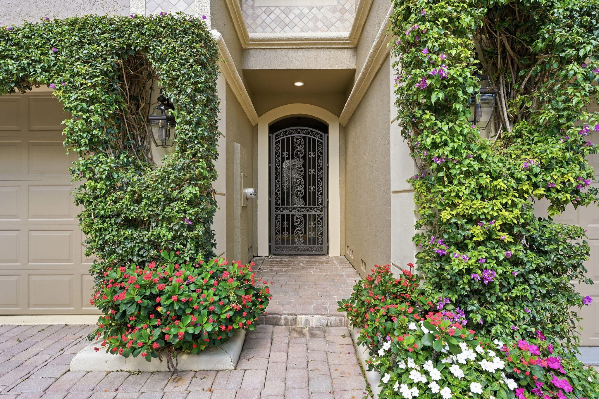921 Osceola Drive, Unit 2 Boca Raton, FL 33432 - Photo 4 of 69 a front view of a house with lots of green space