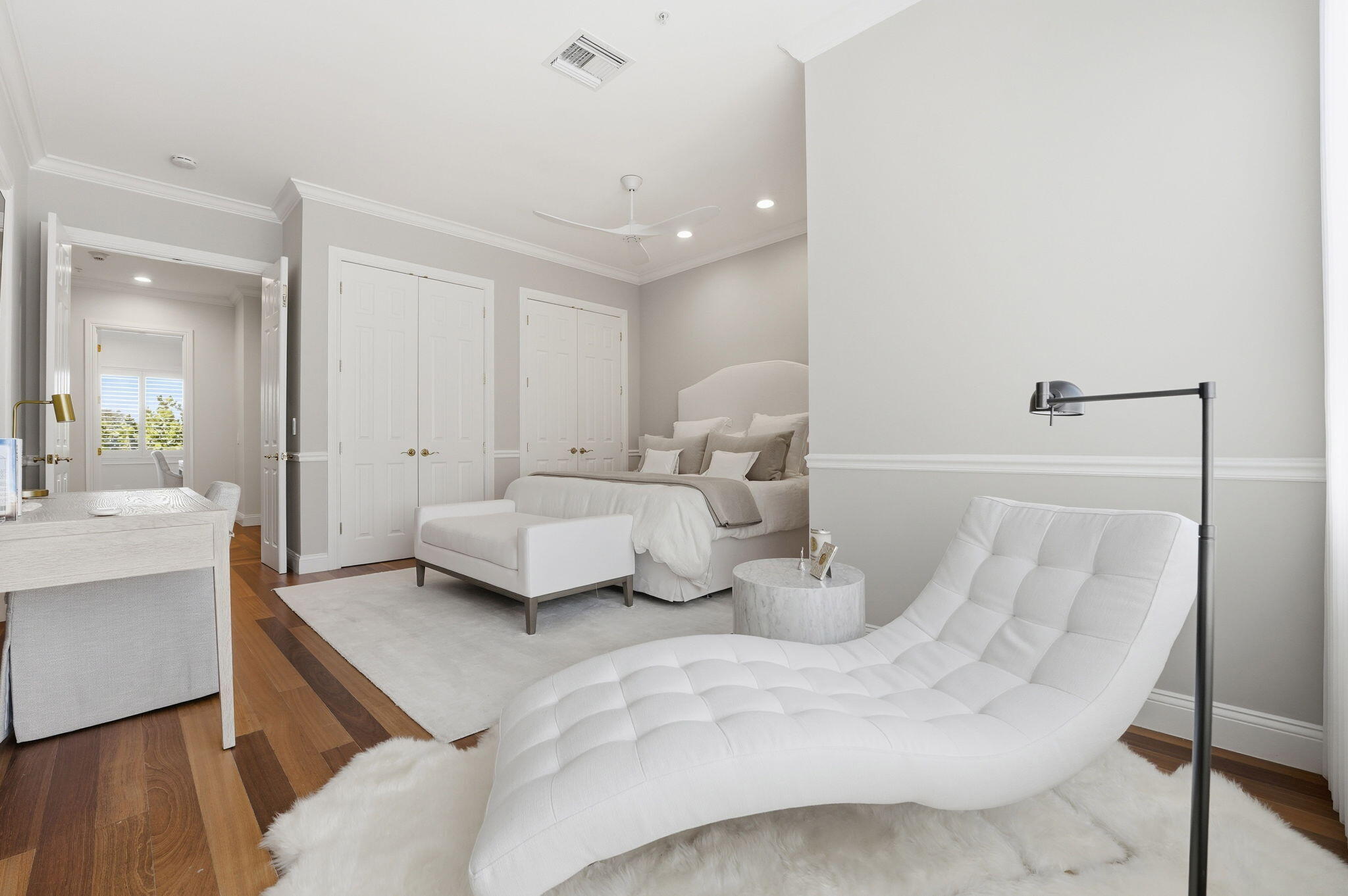 921 Osceola Drive, Unit 2 Boca Raton, FL 33432 - Photo 42 of 69 a bedroom with a large bed and a couch