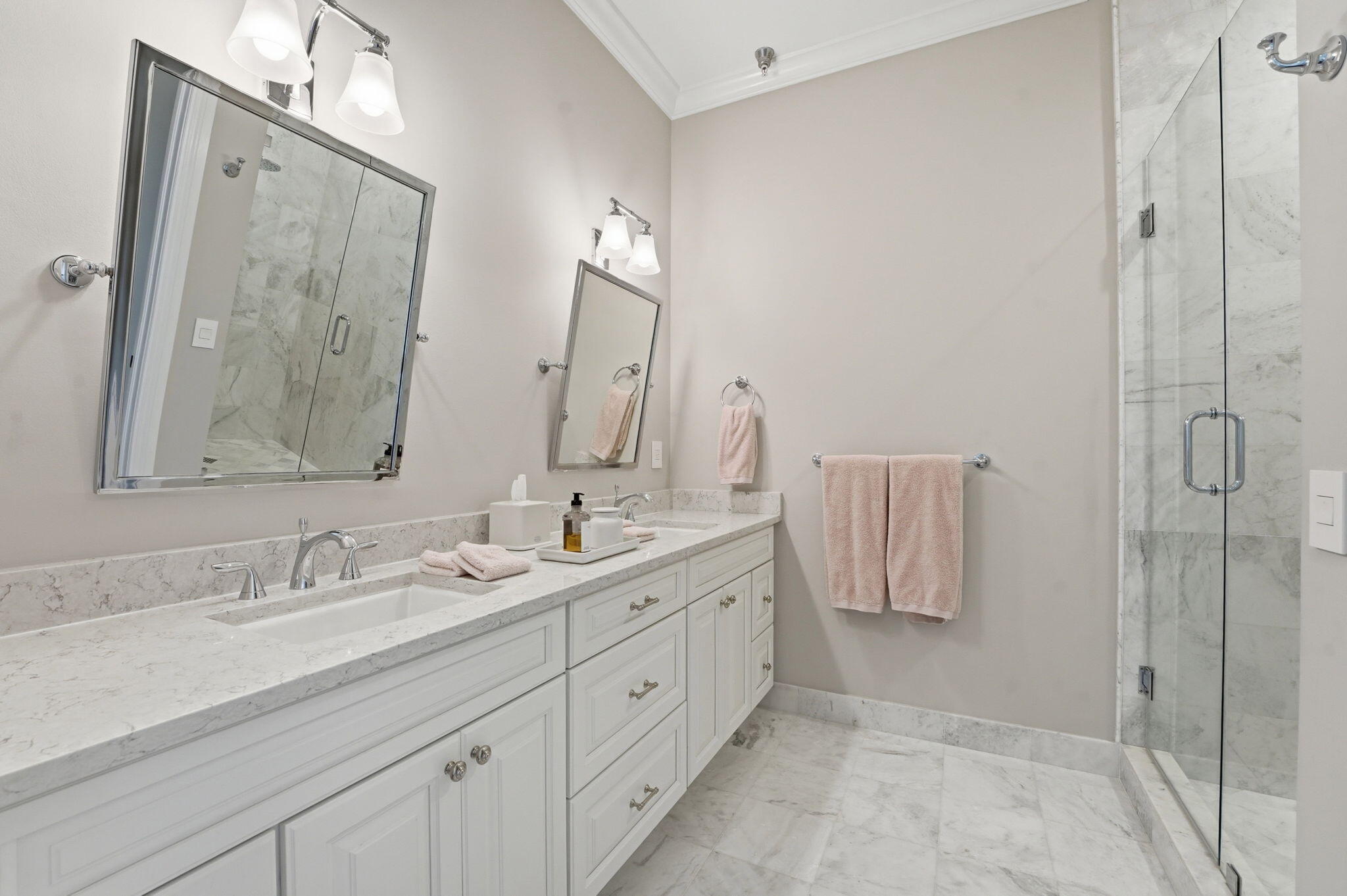 921 Osceola Drive, Unit 2 Boca Raton, FL 33432 - Photo 48 of 69 a bathroom with double vanity sink and a mirror