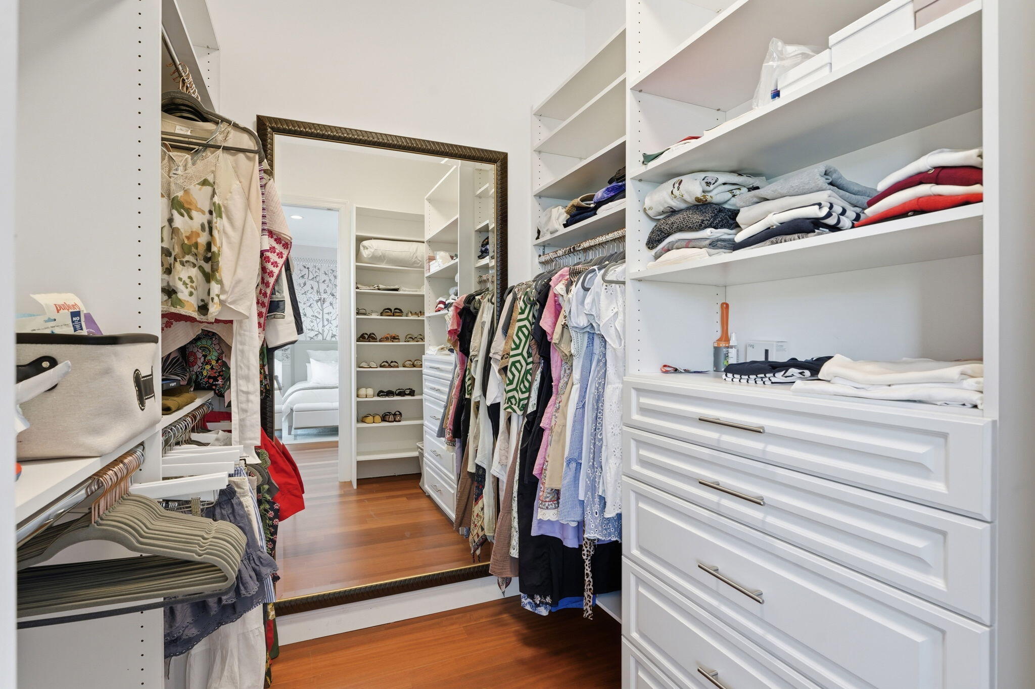 921 Osceola Drive, Unit 2 Boca Raton, FL 33432 - Photo 51 of 69 a view of walk in closet with clothes and shoes