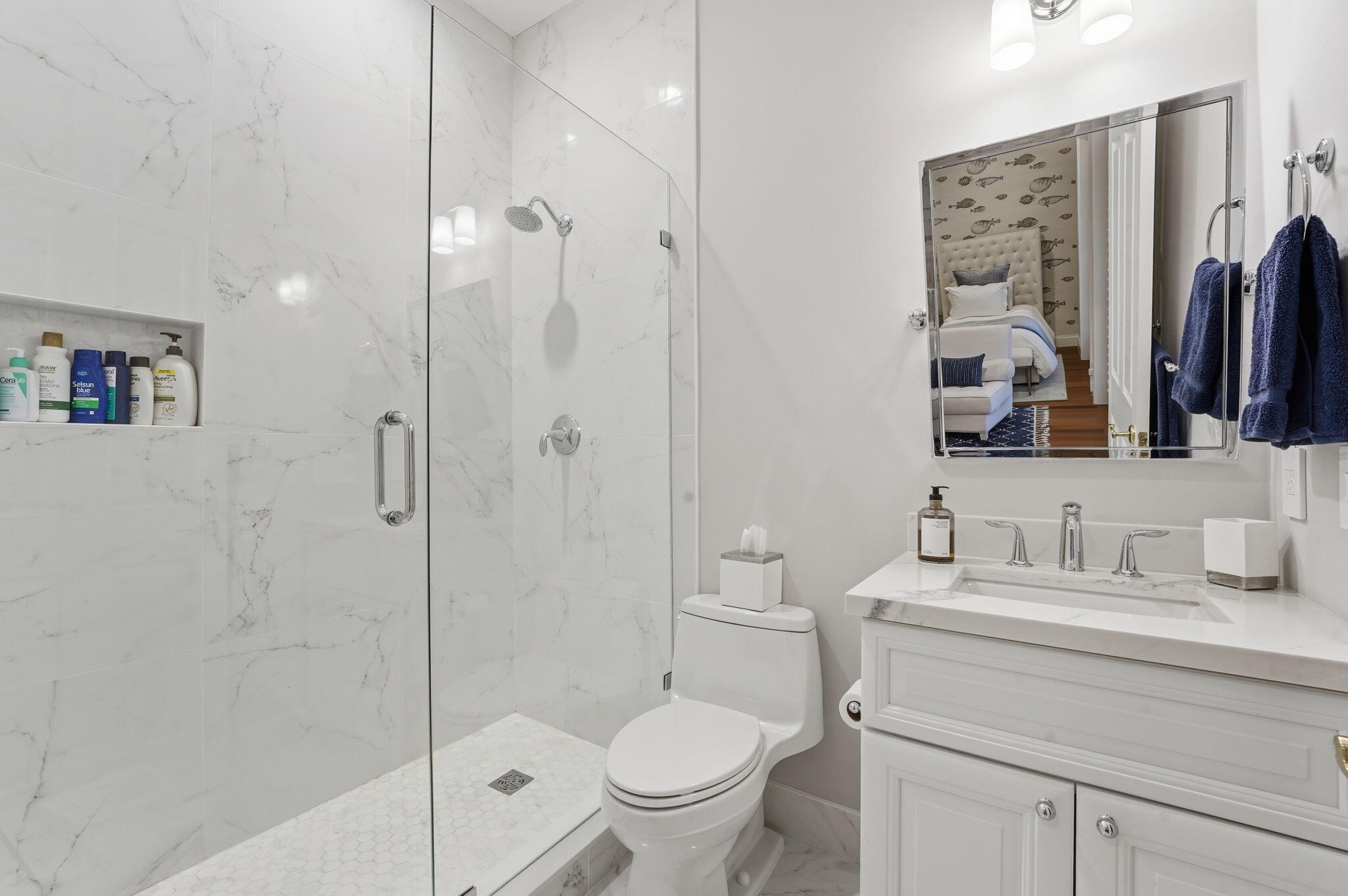 921 Osceola Drive, Unit 2 Boca Raton, FL 33432 - Photo 9 of 69 a bathroom with a toilet sink vanity granite and shower