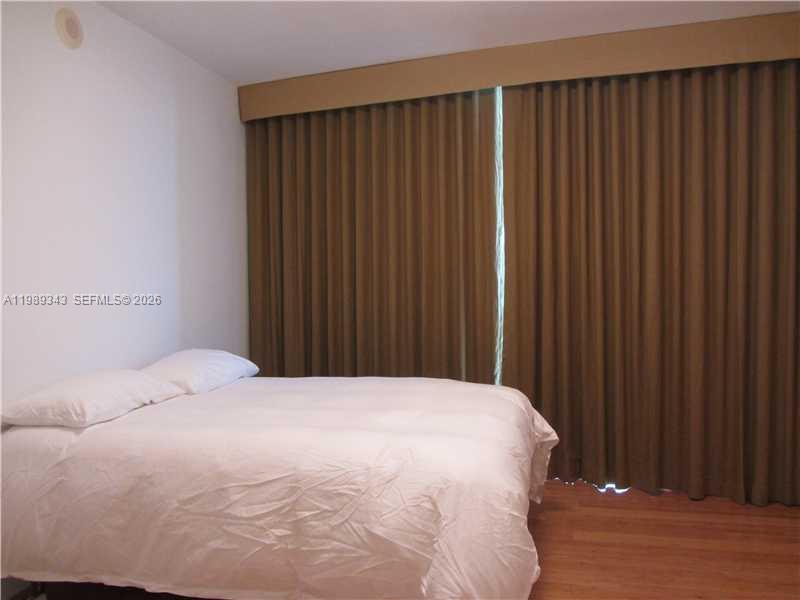 495 Brickell Avenue, Unit 2401 Miami, FL 33131 - Photo 33 of 36 3rd Bedroom's linen curtains
