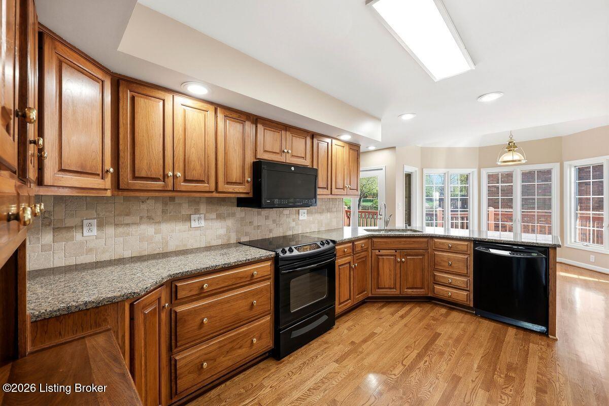 7719 Hermits Run Road Louisville, KY 40291 - Photo 18 of 54 Hardwood floors, matching black appliances