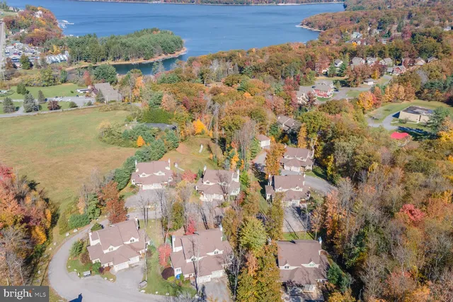 an aerial view of residential houses with outdoor space