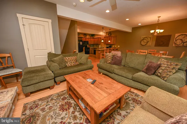 a living room with furniture and a rug