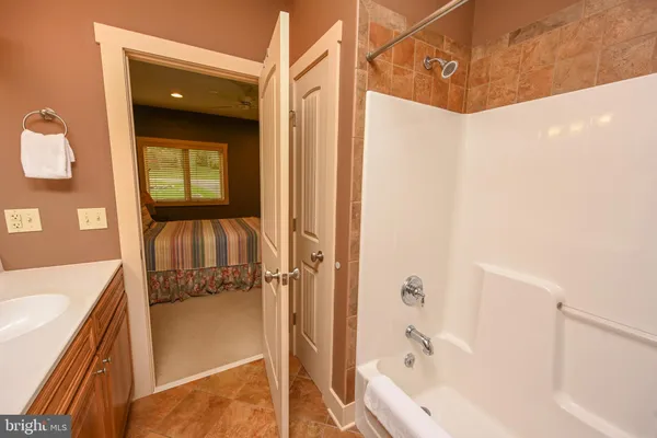 a bathroom with a bathtub and a shower