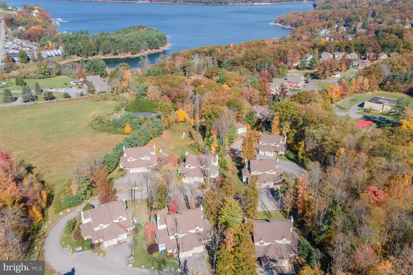 an aerial view of residential houses with outdoor space