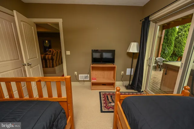 a view of a living room and a large window