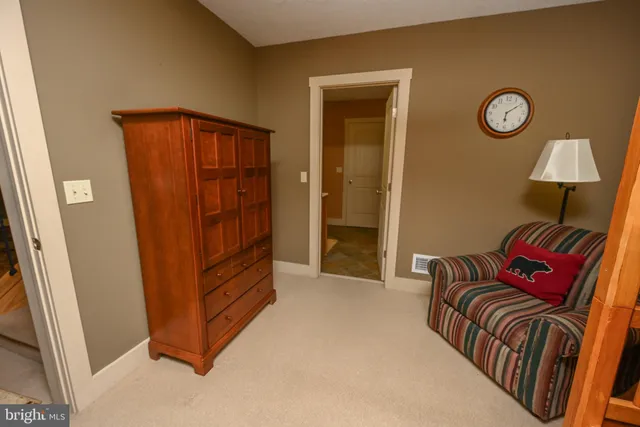 a view of a livingroom with furniture and wooden floor