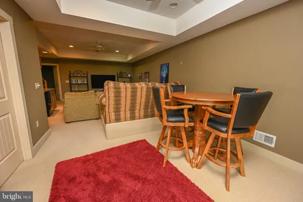 a dinning room with furniture and wooden floor