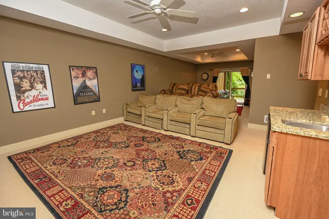 a spacious bedroom with a bed and a dresser